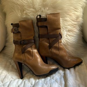 Tod’s two-tone brown leather heeled boots.
